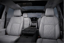 Light grey quilted second-row seats of the OXBROOK N1