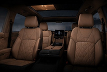 Tan quilted second-row seats of the OXBROOK N1
